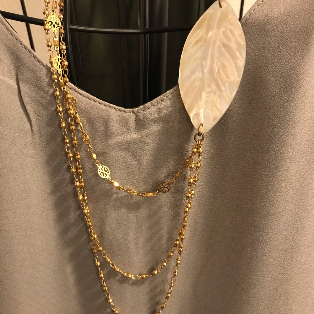 Multi-strand necklace with leaf accent